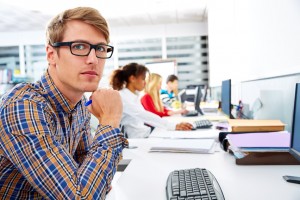 Blond businessman young in office with computer